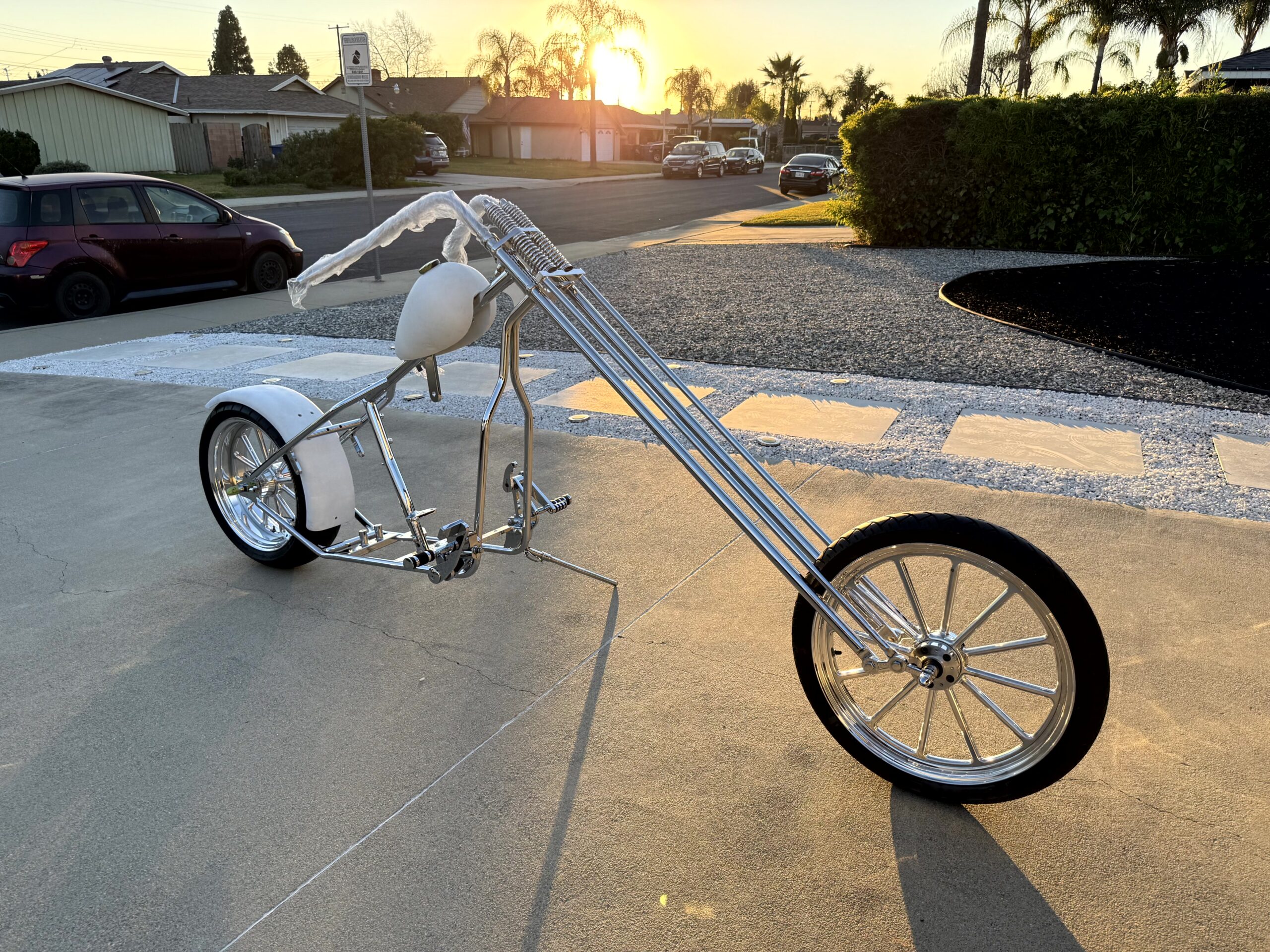 Custom chopper motorcycle parked outdoors